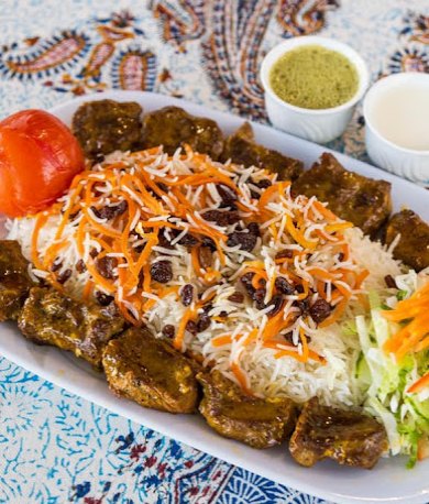 Lamb kebab platter with barberry rice and sauces
