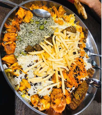 Mixed grill sharing platter with rice and chips